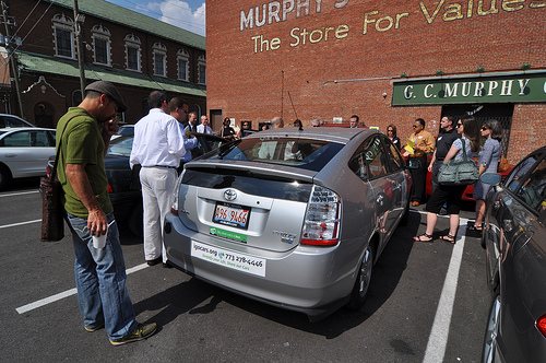 Attendees check out the IGO Prius