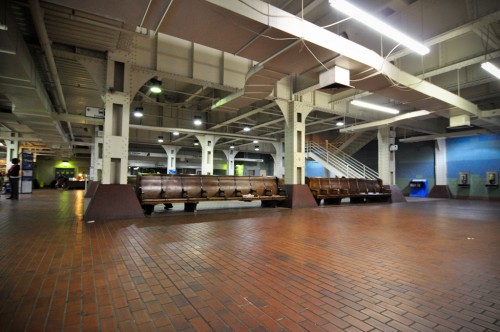 Ground floor waiting area; stairs in background access the platform