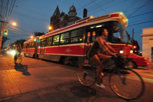 Queen St Streetcar w/ Cyclists (image credit: Curt Ailes)