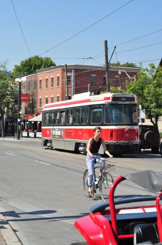 Streetcar w/ Cyclists in Little Italy (image credit: Curt Ailes)