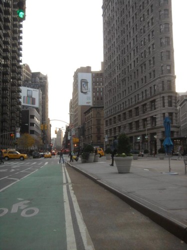 New York's bike lanes next to the Flatiron remind us that bicyclists are part of the city too and deserve space on main routes